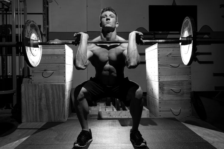 a man doing front squat exercise
